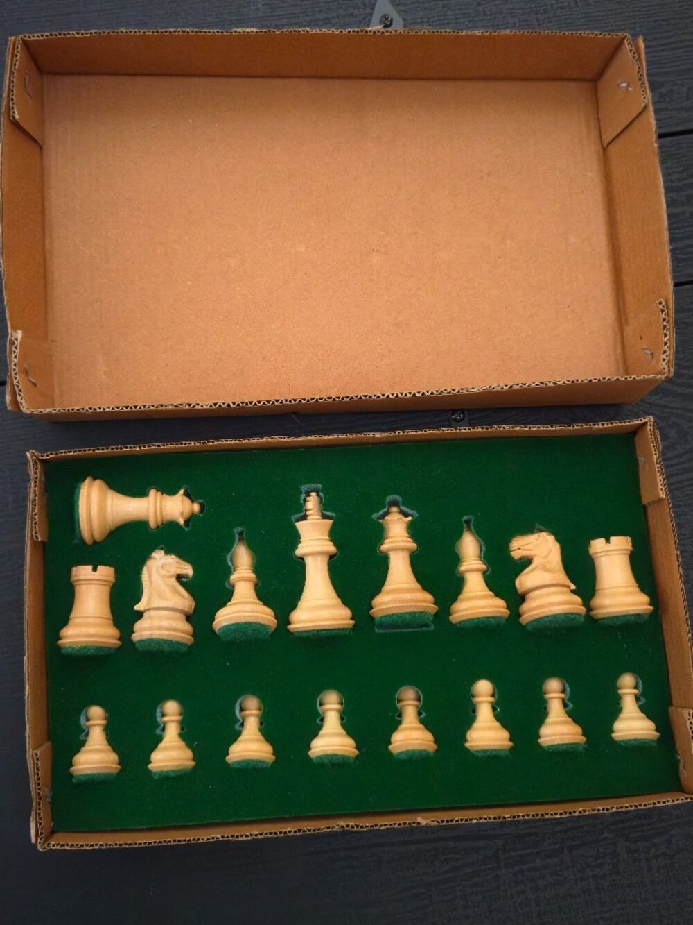 Vintage / new in holder. 17 piece wooden chess set with felt bottoms.